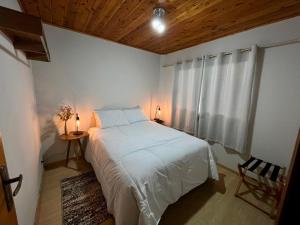 Postel nebo postele na pokoji v ubytování Loft Pucci com ofurô