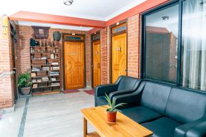 a living room with a couch and a table at City Guest House in Bhaktapur