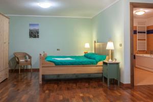 Giường trong phòng chung tại Casolare Santa Margherita