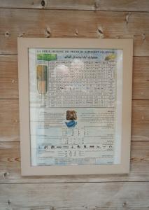 a framed picture of a menu on a wall at Maison du chat bleu in Saint-Hilaire-de-Clisson +33 photos