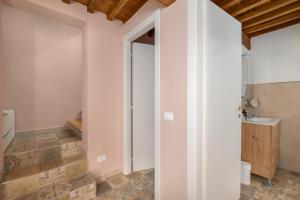 a bathroom with a toilet and a sink at Casa Serena in Vicopisano +8 photos