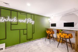 TV a/nebo společenská místnost v ubytování Lexia Hotels