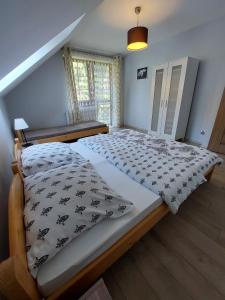 Letto o letti in una camera di Domek na Leśnej Wisła