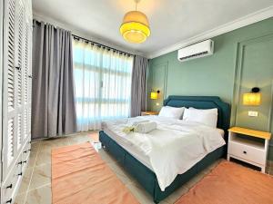 a bedroom with a bed and a large window at Luxury Heaven 10 in Madinaty +26 photos