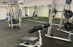 a gym with lots of equipment in a room at RIVAS FCA-PARIS TERRAZA apt in Rivas-Vaciamadrid