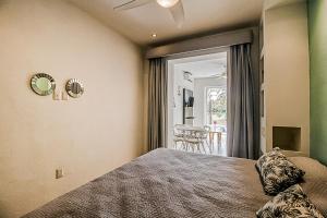 a bedroom with a bed with a ceiling fan at Taheima 2104B at El Tigre in Nuevo Vallarta 