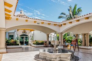 an indoor courtyard with a fountain in the middle at Taheima 2104B at El Tigre in Nuevo Vallarta 