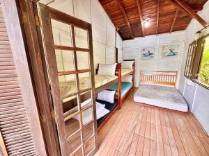 Ένα ή περισσότερα κρεβάτια σε δωμάτιο στο Casa de 2 quartos e 1 mezanino na ilha do Mel próximo ao mar