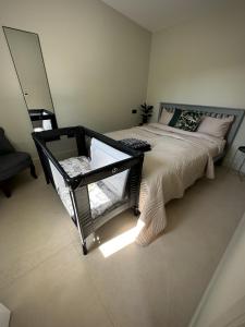 a bedroom with a large bed and a chair at White Oaks Sussex in Twineham