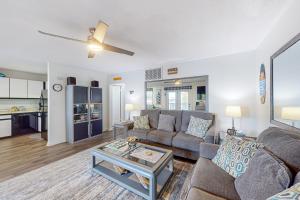 a living room with a couch and a table at Marathon North 103 in Ocean City