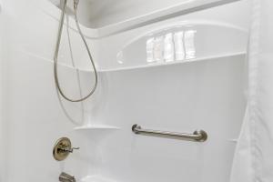 a shower in a bathroom with a sink at Chattanooga House with Grill 12 Mi to Downtown! in Chattanooga +16 photos