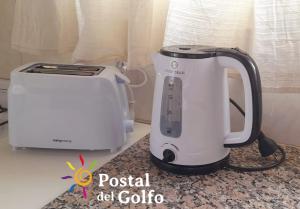 a toaster and a toaster sitting on a counter at Postal del Golfo in Las Grutas