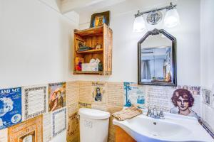 a bathroom with a sink and a toilet at Lake Holbrook Waterfront Vacation Rental with Dock! in Mineola