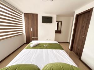 Säng eller sängar i ett rum på Hotel RYA Center