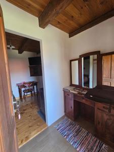 a living room with a mirror and a table at Apartments Kuvarna in Čigoč +36 photos