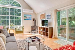a living room with a couch and a tv at half Mi to Ogunquit Beach Maine Home with Deck! in Ogunquit