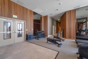 a gym with treadmills and exercise equipment in a building at Private Terrace in Luxury 3BR Condo in Brickell in Miami +28 photos