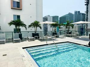 a swimming pool on the roof of a building at Private Terrace in Luxury 3BR Condo in Brickell in Miami