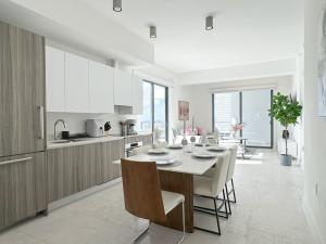 a kitchen and dining room with a table and chairs at Private Terrace in Luxury 3BR Condo in Brickell in Miami