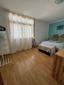 Łóżko lub łóżka w pokoju w obiekcie Casa Gino