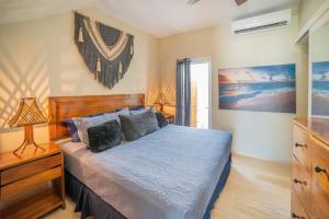 a bedroom with a bed with a wooden headboard at papaya 15 Exclusive PentHouse with rooftop and jacuzzi in Playa del Carmen +34 photos