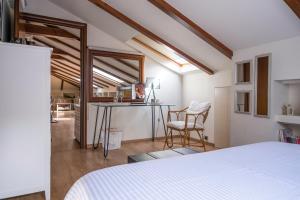 A bed or beds in a room at Loft 38 Ioannina