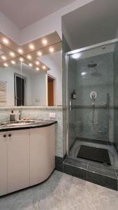 a bathroom with a shower and a sink at Casa Maino in Rho +8 photos