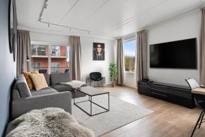 โทรทัศน์และ/หรือระบบความบันเทิงของ ARCTIC HOMES - Premium Tromsø Residence +21 ภาพ