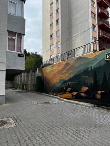a mural on the side of a building at Smile Studio in Suceava +41 photos