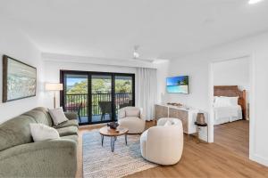 a living room with a couch and a bed at Deluxe Condo - Modern Furnishings and Great View in Naples +41 photos