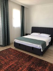 Postel nebo postele na pokoji v ubytování Demre Asya Apart