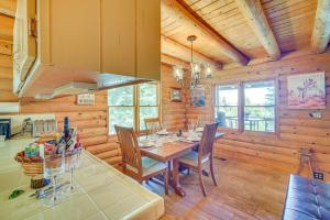 a kitchen and dining room with a table and chairs at Crestline Area Vacation Rental Cabin with Decks! in Crestline