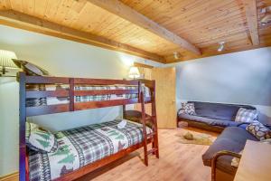 a room with two bunk beds and a couch at Crestline Area Vacation Rental Cabin with Decks! in Crestline