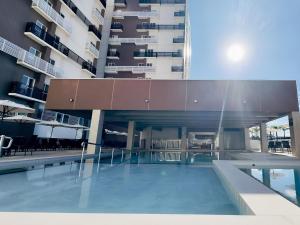 A piscina localizada em Spazzio Diroma Com acesso gratuíto ao Acqua Park - D ou nos arredores