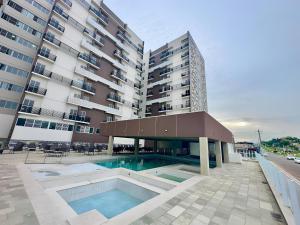 A piscina localizada em Spazzio Diroma Com acesso gratuíto ao Acqua Park - D ou nos arredores