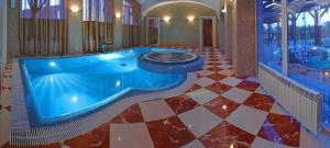 a large swimming pool in a large room at Gorny Ruchej in Hora