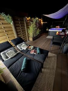 Setusvæði á Gîte Studio Alsa 15 avec Jacuzzi privatif