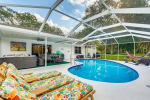 a house with a pool and a patio at Spacious Citrus Hills Home with Pool and Game Room! in Hernando