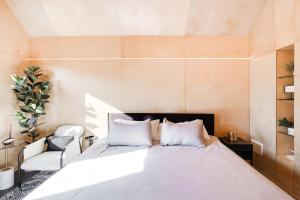 a bedroom with a large bed with two white pillows at Bunkies-Old Salt in Ottawa +26 photos