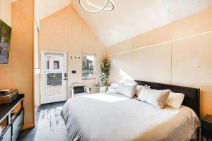 a bedroom with a large bed and a window at Bunkies-Old Salt in Ottawa