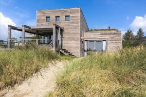 a house on top of a sand hill at Seaside Panorama Villa 6p - Direct aan de Baai - Villa 37 in Ouddorp