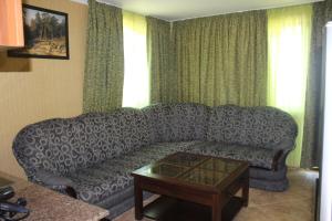 a living room with a couch and a coffee table at Villa Katalina in Varna City