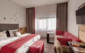 Postel nebo postele na pokoji v ubytování Hotel Traumschmiede