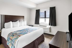 Voodi või voodid majutusasutuse SureStay Studio by Best Western Hardisty toas