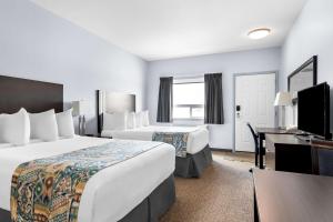 Voodi või voodid majutusasutuse SureStay Studio by Best Western Hardisty toas