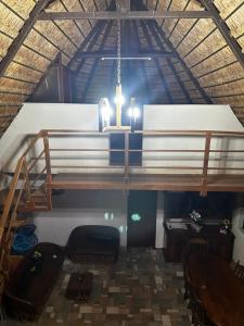 a chandelier in a room with a table and a bench at Cabañas y hospedaje Sol y Luna Motul in Motul de Felipe Carrillo Puerto +62 photos