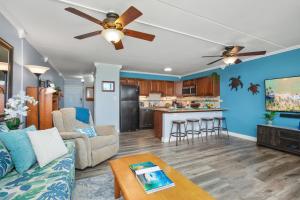 a living room with a couch and a ceiling fan at Kihei Ali'i Kai Condo with King Bed, 55'' Smart TV, Free Parking! in Kihei