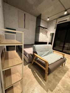 a room with a bed and a bunk bed in a trailer at 基隆正榮003 in Pa-ch'ih-men