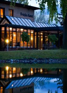 a rendering of the exterior of the fletcher hotel at night at Friesen Hotel in Jever