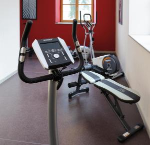 a room with a gym with a exercise bike at Residhome Grenoble Caserne De Bonne in Grenoble